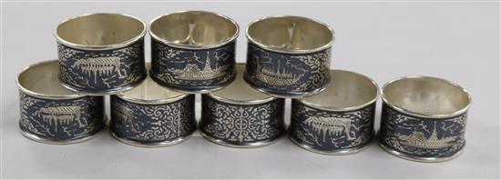 A set of eight continental white metal and niello napkin rings.